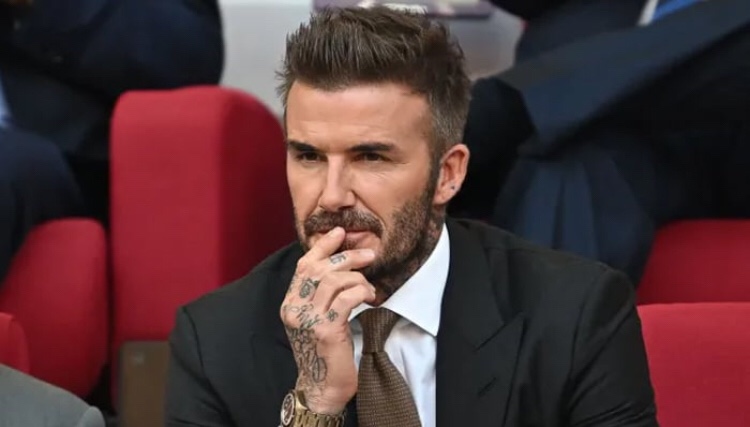 Is David Beckham hiding his new hairstyle?
